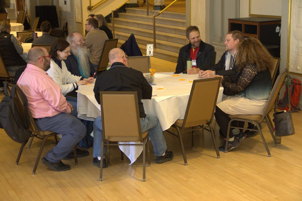 Mike Crawford and Jay Ray engaging in conversation
